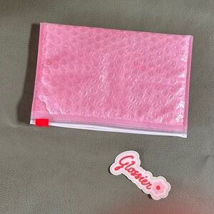 Glossier Pink Bubble Pouch with Red Accents